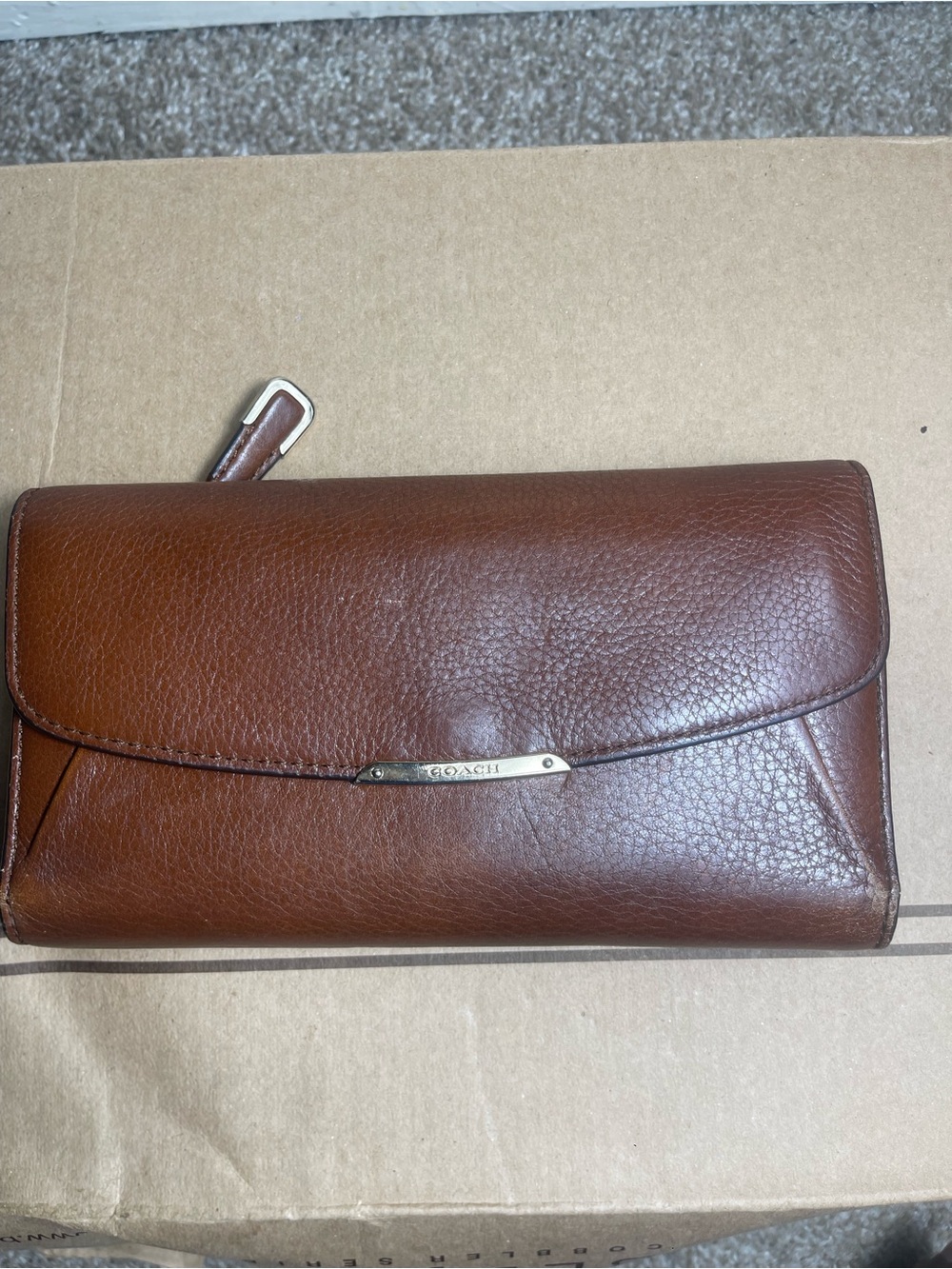 Coach Brown Pebbled Leather Flap Wallet with Silver Plaque